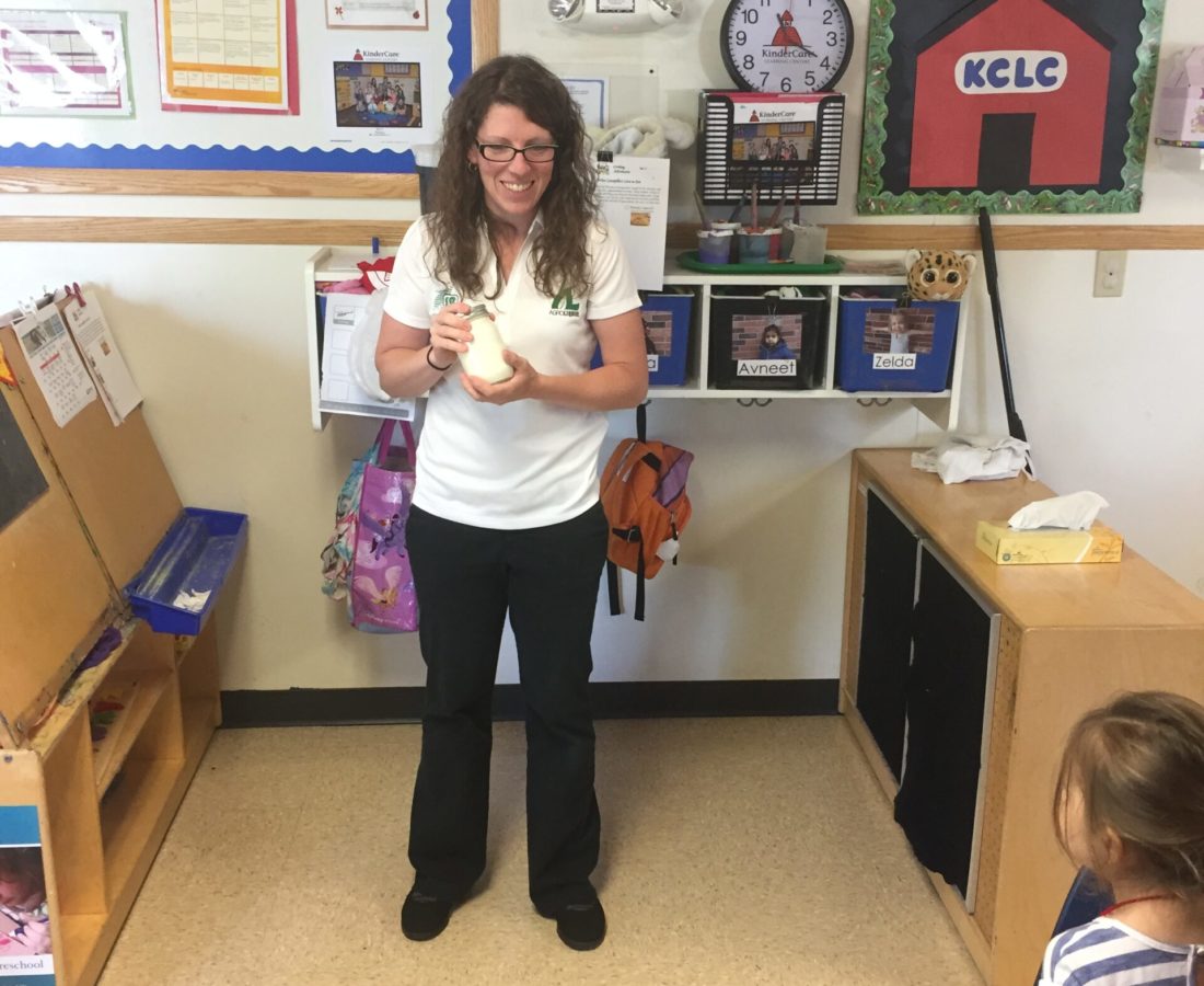 Emily Crambell teaching a classroom full of young students